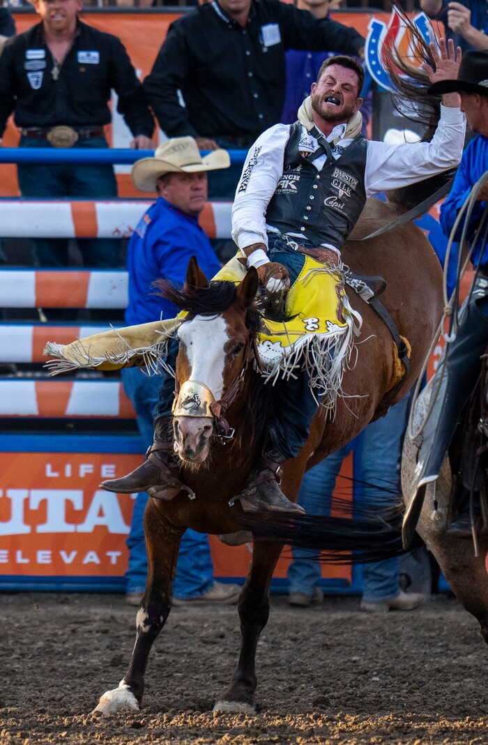 (Rick Egan | The Salt Lake Tribune) RC Landingham, from Hat Creek, Calif., competes in the bareback riding competition at the Utah Days of '47 Rodeo at the State Fairpark, on Monday, July 25, 2022.