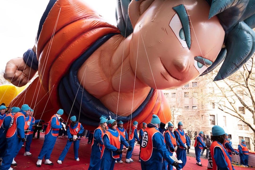 (Mark Lennihan | AP)  Balloon handlers hold Goku balloon close to the ground as strong winds affect the Macy's Thanksgiving Day Parade, Thursday, Nov. 28, 2019, in New York.