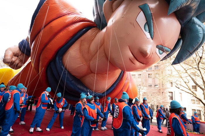 (Mark Lennihan | AP) Balloon handlers hold Goku balloon close to the ground as strong winds affect the Macy's Thanksgiving Day Parade, Thursday, Nov. 28, 2019, in New York.