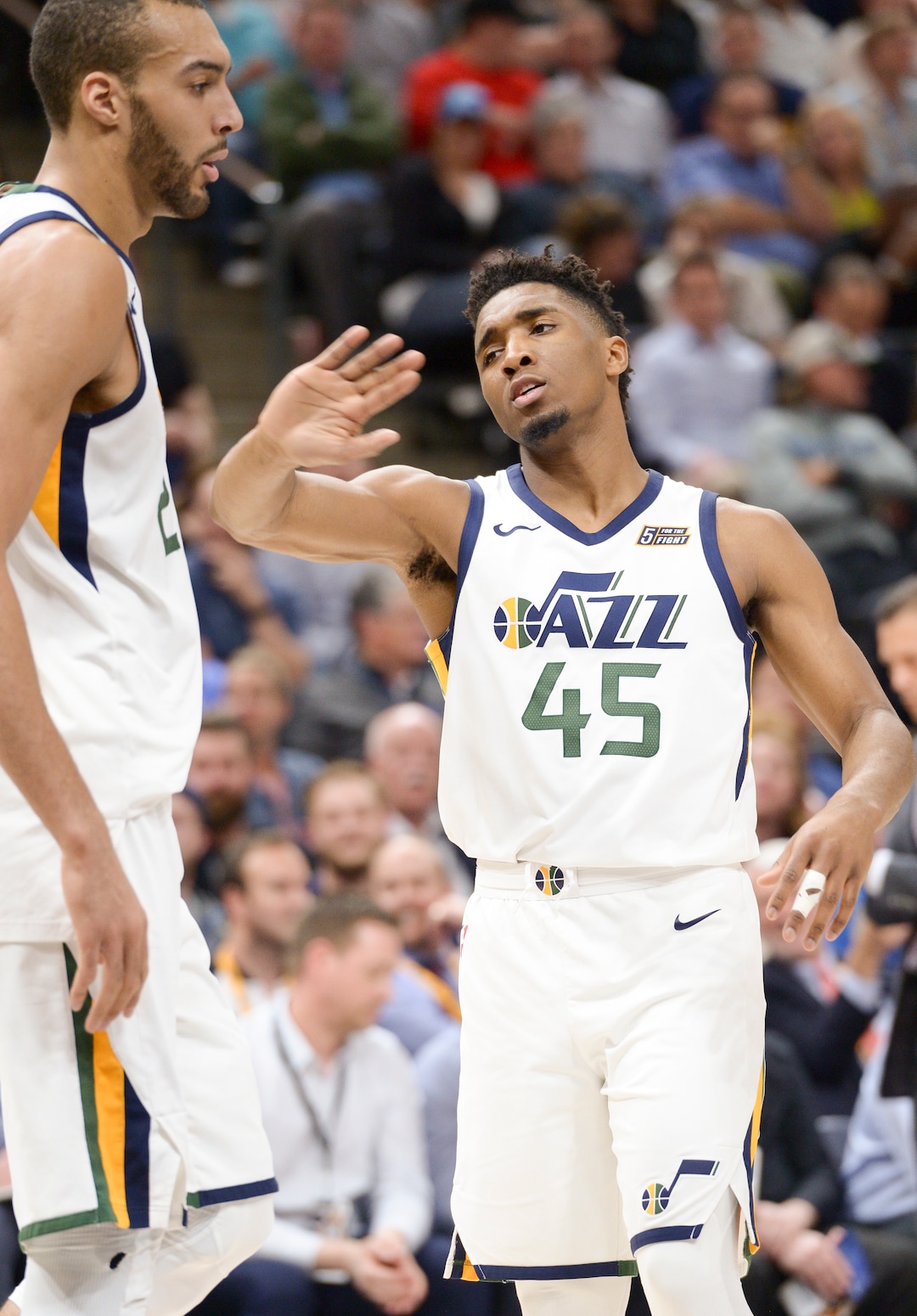 (Leah Hogsten  |  The Salt Lake Tribune)  Utah Jazz guard Donovan Mitchell (45) congratulates Utah Jazz center Rudy Gobert (27) on his aggressive play.  The Utah Jazz lead the Golden State Warriors 62-33 during their game, Tuesday, April 10, 2018 at the Vivant Smart Home Arena. 