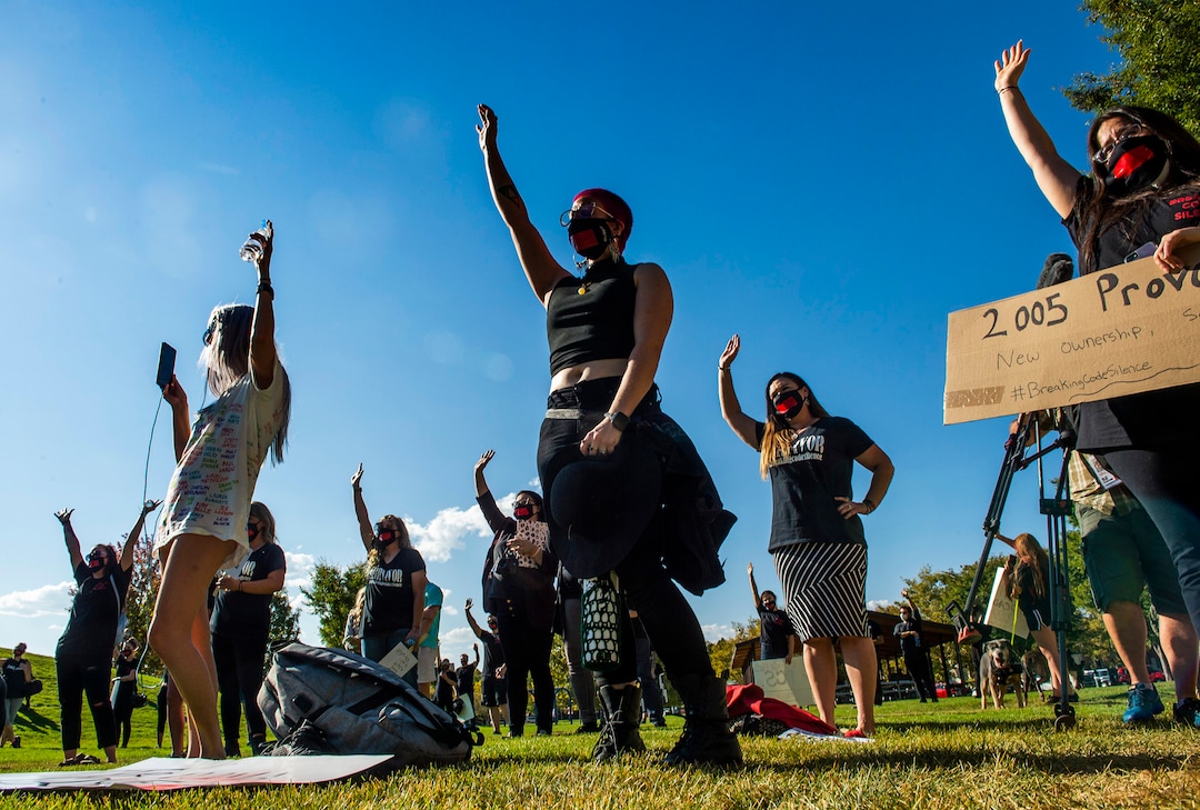 (Rick Egan  |  The Salt Lake Tribune)    Survivors raise their hands as they are asked if the witnesses or were abused during their stay at a residential treatment center, during a rally calling for the closure of Provo Canyon School, a residential treatment center in Utah she attended when she was a teen, on Friday, Oct. 9, 2020.