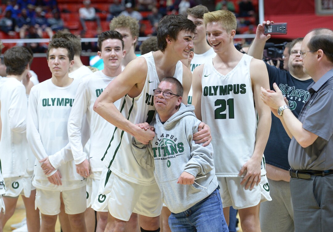 (Leah Hogsten  |  The Salt Lake Tribune) Olympus' Max Calton (13) and team manager Craig Strasser celebrate the win. Olympus defeated Corner Canyon 76-49 to win the 5A High School Boys’ Basketball Tournament Championship at the Jon M. Huntsman Center in Salt Lake City,  Saturday, March 3, 2018. 