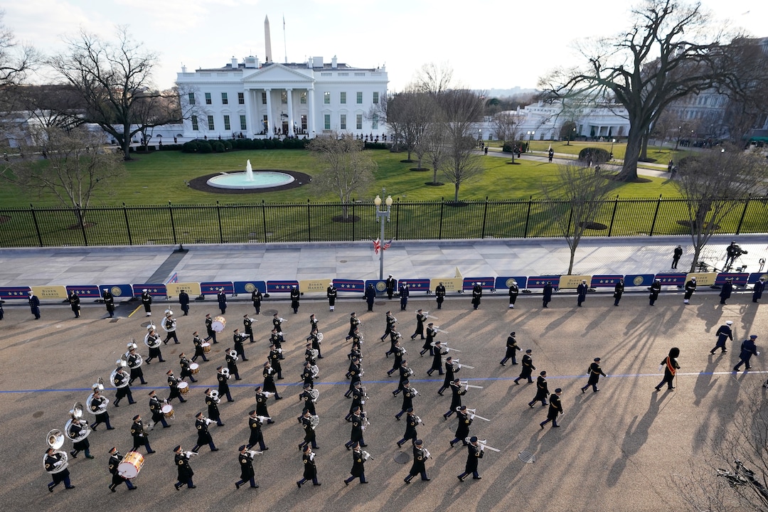 A U.S. Army band marches near the White House during the Presidential Escort, part of Inauguration Day ceremonies, Wednesday, Jan. 20, 2021, in Washington. (AP Photo/David J. Phillip)