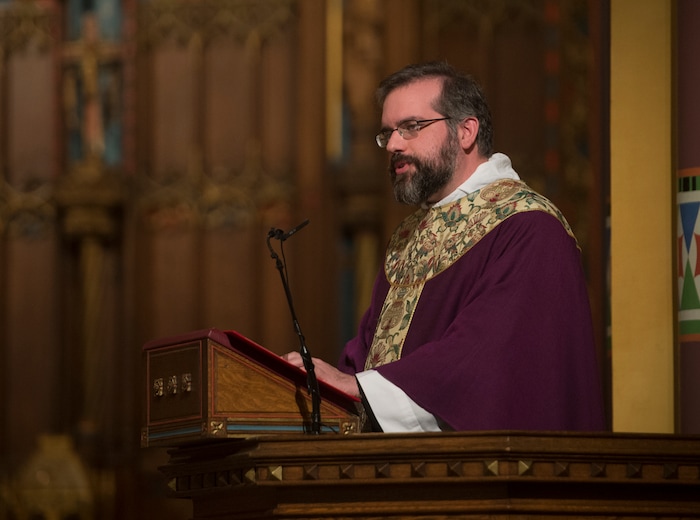 (Rick Egan | The Salt Lake Tribune) The Reverend Christopher P. Gray, reads from the Gospel of Mathew, during the Ash Wednesday Mass, at the Cathedral of The Madeleine, Wednesday, Feb. 14, 2018.