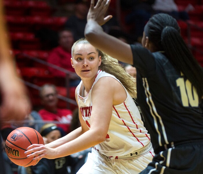 (Rick Egan  |  The Salt Lake Tribune)  Utah Ute's guard, Megans Jacobs (13) takes the ball inside as,  Purdue Boilermakers guard Andreona Keys (10) defends, in basketball action Utah Utes vs. Purdue Boilermakers, at the Jon M. Huntsman Center, Monday, Nov. 20, 2017.