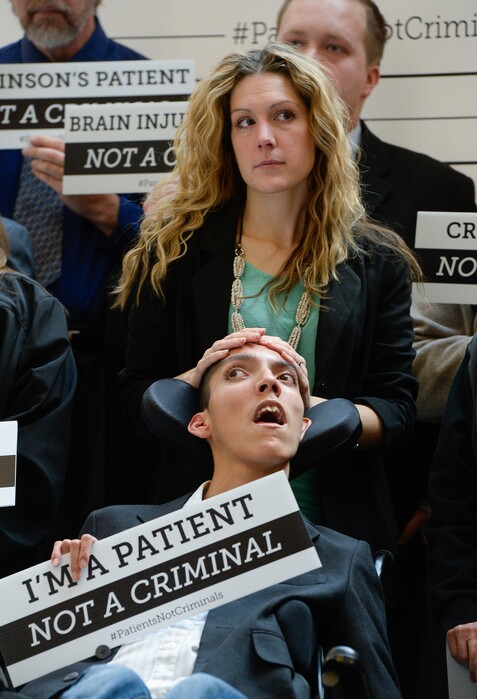 Francisco Kjolseth | The Salt Lake Tribune
Desiree Hennessy embraces her son Hestevan, 21, who suffers from seizures and chronic nerve pain. District Attorney Sim Gill held a press conference at the State Capitol to announce a new patient initiative supporting medical cannabis. Medical cannabis patients, each representing a different condition covered under Senator Madsen's bill, openly admit having violated Utah's marijuana laws out of medical necessity. District Attorney Sim Gill is advocating in support of changing policy to ensure that patients are not treated as criminals.