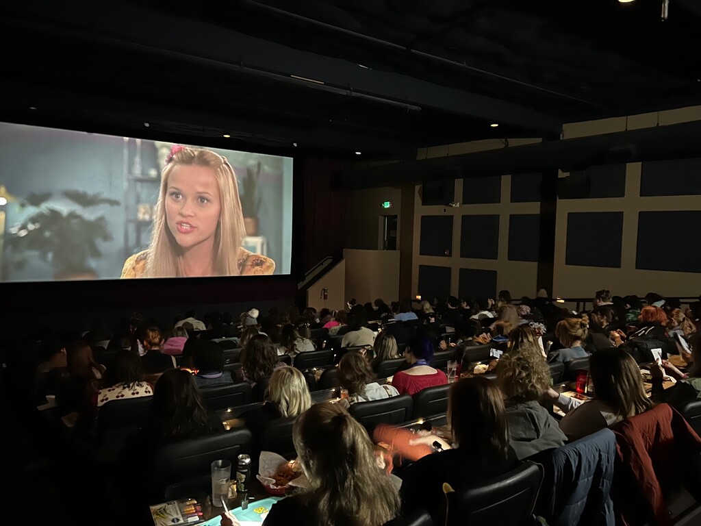 (Madison Whitlock) People watch "Legally Blonde" while crafting as part of CineCraft Utah, a hobby group.