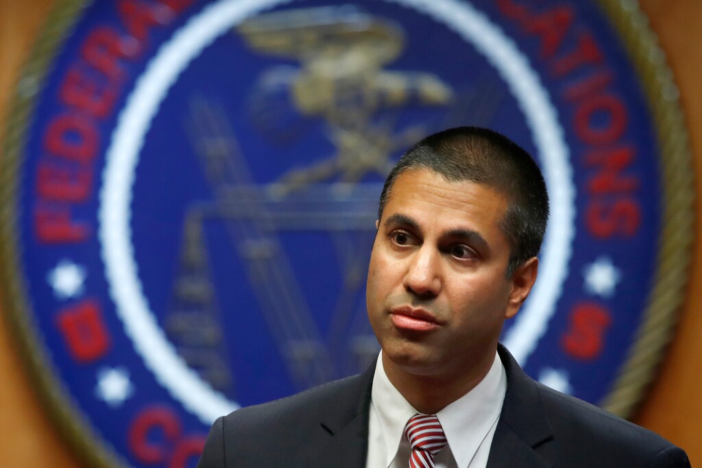 Federal Communications Commission (FCC) Chairman Ajit Pai arrives for an FCC meeting where they will vote on net neutrality, Thursday, Dec. 14, 2017, in Washington. (AP Photo/Jacquelyn Martin)
