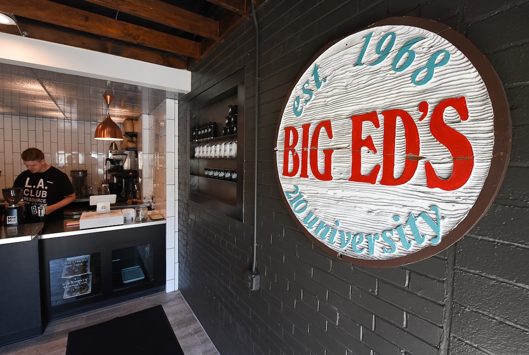 (Francisco Kjolseth  |  The Salt Lake Tribune)  The wooden sign from Big Ed's hangs near the front door at Publik Ed's, a new coffee shop and restaurant near the University of Utah.