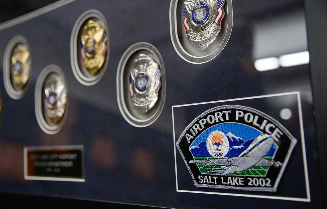 (Francisco Kjolseth  |  The Salt Lake Tribune)  A shadow box displays former patches and badges used by the airport police, established in 1984, during a ceremony to retire their patch and badge on Tuesday, Feb. 26, 2019. 