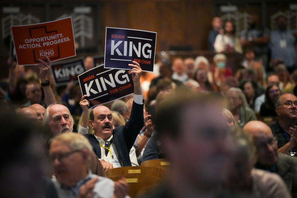 (Bethany Baker | The Salt Lake Tribune) Supporters wave a sign as Utah Democratic Party chair candidate Brian King speaks during the party's 2025 organizing convention in Ogden on Saturday, May 31, 2025.