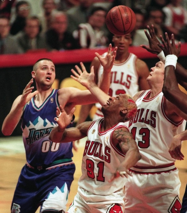 Tribune file photoUtah Jazz's Greg Ostertag (00) battles with Chicago Bulls' Dennis Rodman (91) and Luc Longley (13) for a rebound during the first quarter of Game 2 of the NBA Finals Wednesday, June 4, 1997, in Chicago. 