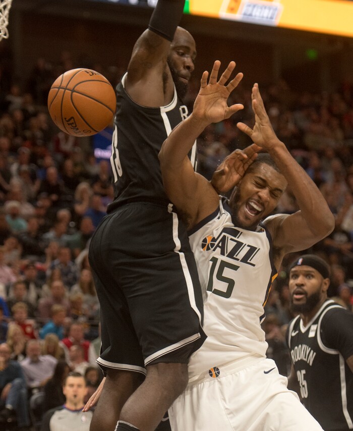 (Rick Egan  |  The Salt Lake Tribune) Utah Jazz forward Derrick Favors (15) collides with Brooklyn Nets forward Quincy Acy (13), in NBA action, Utah Jazz vs. Brooklyn Nets, in Salt Lake City, Saturday, November 11, 2017.