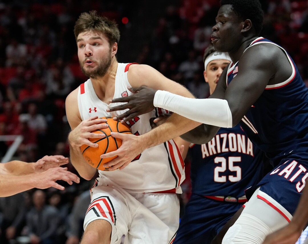 (Francisco Kjolseth | The Salt Lake Tribune) Utah Utes guard Rollie Worster (25) pushes past Arizona Wildcats center Oumar Ballo (11) as the University of Utah hosts the Arizona Wildcats in NCAA basketball in Salt Lake City on Thursday, Dec. 1, 2022.