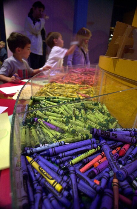 (Da n Loh | The Associated Press) Children play with Crayola crayons Tuesday, June 6, 2000, in Easton, Pa., at the Crayola factory museum. The nation's top three crayon manufacturers have agreed to reformulate their crayons to remove asbestos-like fibers, even though government tests say the fibers pose little risk to the health of children.