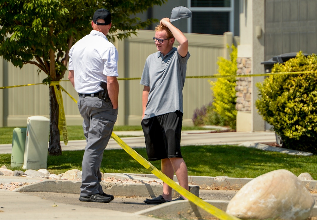Leah Hogsten  |  The Salt Lake Tribune  Parker Youd, 17, talks with a Payson Police Department investigator.  Youd's father Duane "Rhedd" Youd crashed a plane he was piloting about 2:30 a.m., Monday, August 13, 2018 into a house at 584 E. East Canyon Road in Payson. Youd died in the plane crash. Firefighters arrived to find the home engulfed in flames. The two people inside the home escaped through the back of the home and were uninjured. Youd had been booked into the Utah County Jail about 7:30 p.m. Sunday after being suspected of assaulting his wife. He bailed out of jail; returned to the home with a police officer about midnight to retrieve belongings and his truck; and left without incident. 