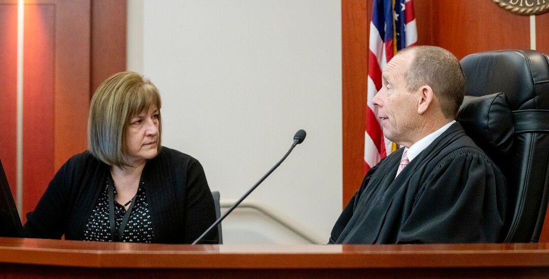 (Scott G Winterton  |  Deseret News/Pool) Juvenile Judge Renee Jiminez talks with Judge Paul B. Parker after they took care of their calendar on Friday, Dec. 13, 2019. Utah's juvenile judges will soon begin taking on cases in adult court, a move to help relieve crowded courtrooms in the state's most populated judicial district.