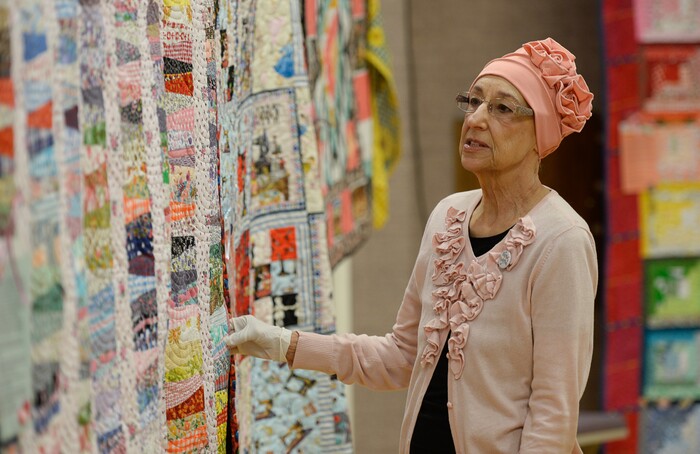 (Francisco Kjolseth  |  The Salt Lake Tribune)  Overlooking her handy work, Nacele Hart has made more than 100 quilts and numerous sewing projects over a 10-year period for her children, grandchildren and great-grandchildren. On Friday at a church in Orem her family put them on display with plans to hand them out Saturday to her loved ones. She's also currently battling cancer.