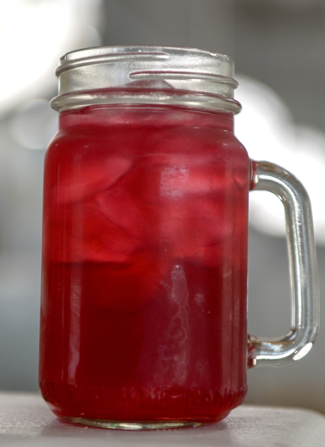 (Leah Hogsten  |  The Salt Lake Tribune)  Sauce Boss Southern Kitchen's house red drink made with hibiscus roselle flower tea, pineapple, gingers and a touch of lemonade. The tea with many names — bissap, sorrell, agua de jamaica — was created in West Africa and brought to the United States during the transatlantic slave trade. Chef Julius Thompson is expressing his love for his Southern roots at his restaurant, Sauce Boss Southern Kitchen, Sept. 10, 2019.