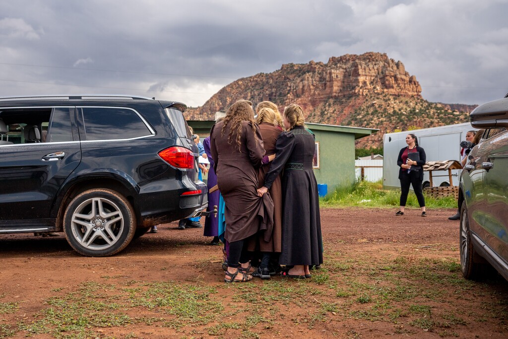 (Trent Nelson | The Salt Lake Tribune) Girls huddle together before being removed from the home of Samuel Bateman by the Arizona Department of Child Safety, in Colorado City, Ariz., on Wednesday, Sept. 14, 2022. The self-proclaimed leader of a new polygamous sect on the Utah-Arizona border has used prison phones to talk sexually with underage girls.