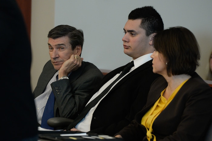 (Francisco Kjolseth  |  The Salt Lake Tribune)  Former Brighton High and University of Southern California linebacker Osa Masina, center, is joined by his defense attorney's Greg and Rebecca Skordas during his sentencing for sexual battery at the Matheson Courthouse in Salt Lake City on Tuesday, Dec. 5, 2017. Masina was sentenced to 365 days in jail, followed by two years on probation.