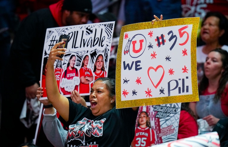 (Bethany Baker | The Salt Lake Tribune) A fan of Utah Utes forward Alissa Pili (35) cheers during the game at Jon M. Huntsman Center in Salt Lake City on Saturday, March 2, 2024.