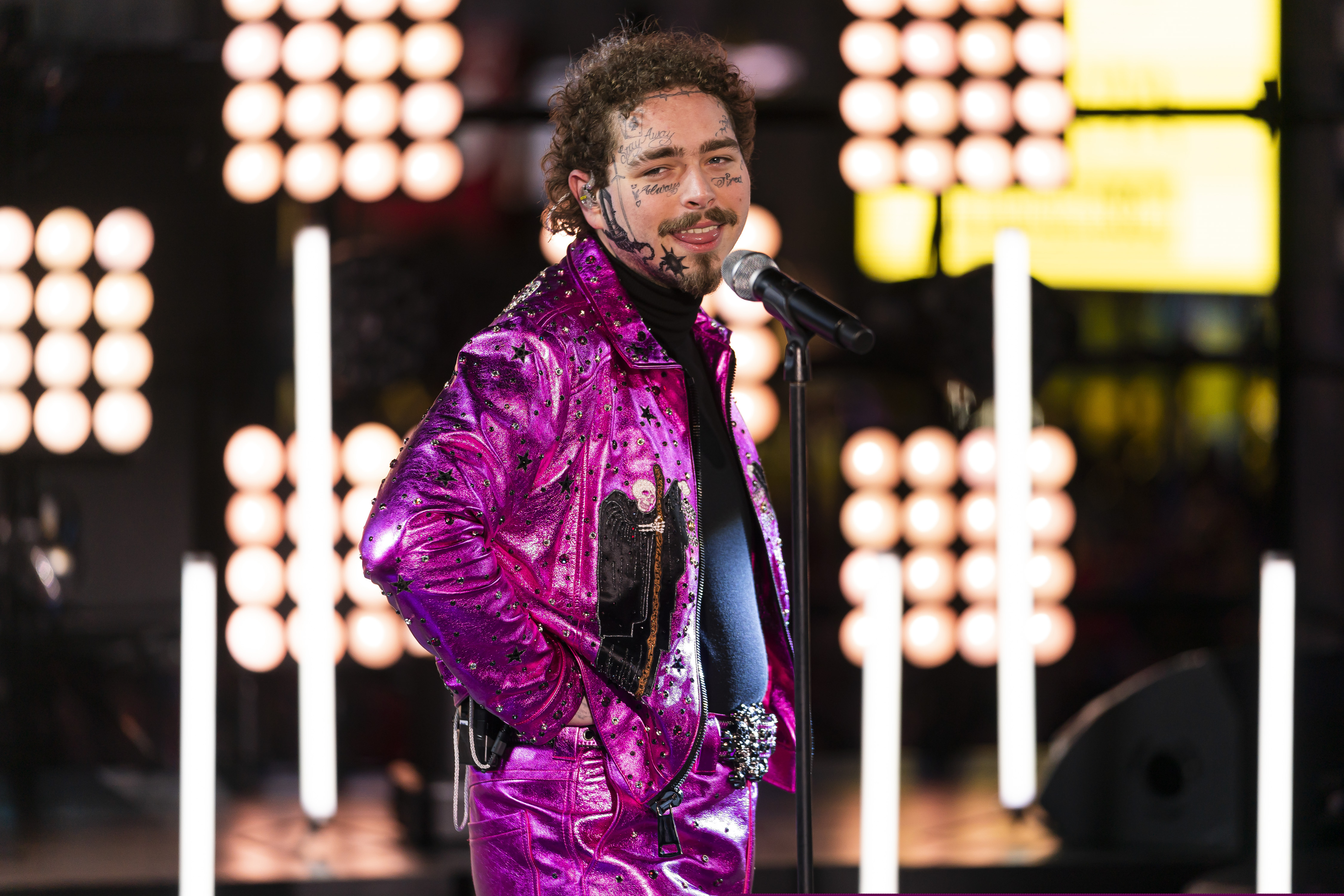 (Ben Hider | Invision/AP) Post Malone performs at the Times Square New Year's Eve celebration, Tuesday, Dec. 31, 2019, in New York.