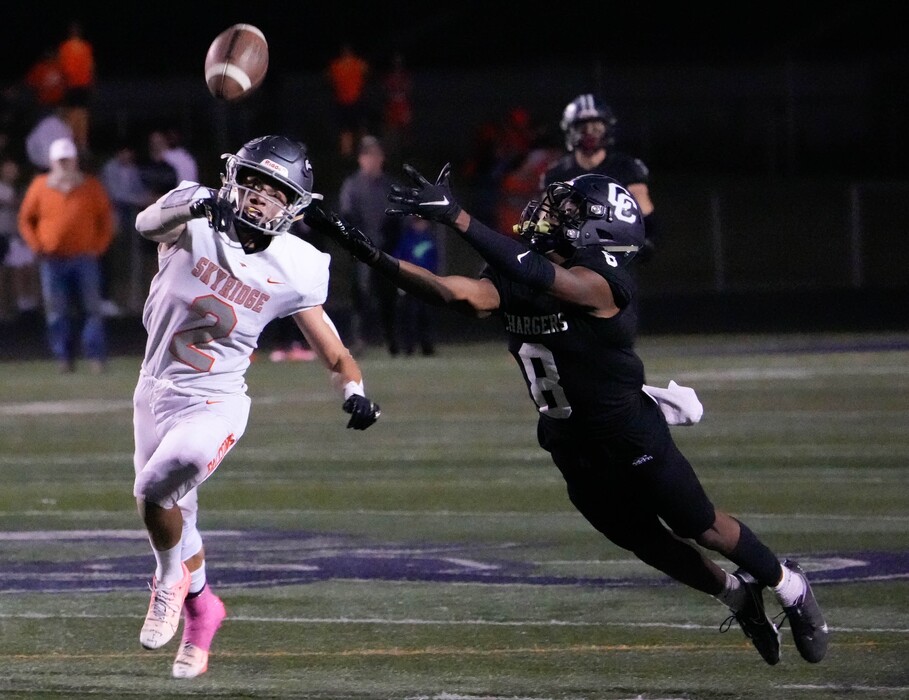(Francisco Kjolseth | The Salt Lake Tribune) Jack Hadfield (2) of Skyridge tries to catch a pass intended for Jared Malula (8) of Corner Canyon in prep football action between the Corner Canyon Chargers and the Skyridge Falcons, on Friday, Sept. 24, 2021, in Draper.