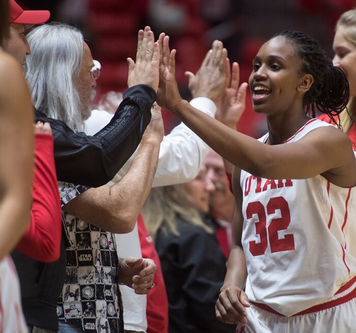 (Rick Egan  |  The Salt Lake Tribune)  Utah Utes forward Tanaeya Boclair (32) high- fives fans after the Utes defeated the Boilermakers 81-68, in basketball action Utah Utes vs. Purdue Boilermakers, at the Jon M. Huntsman Center, Monday, Nov. 20, 2017.