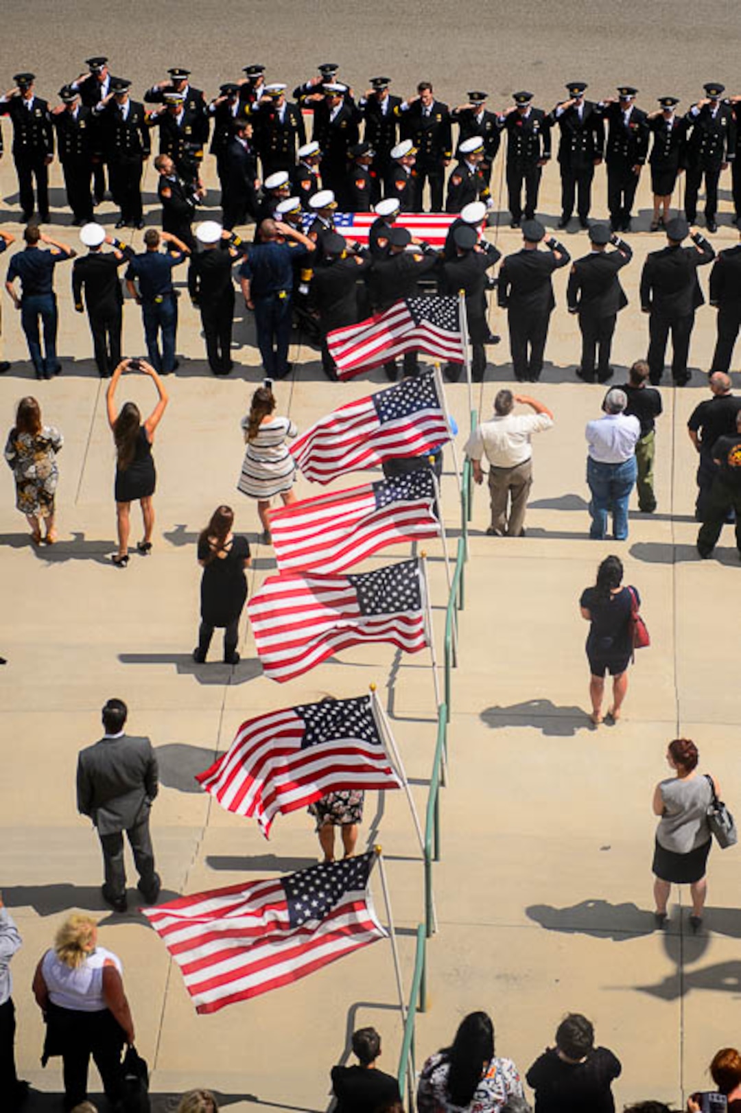 (Trent Nelson | The Salt Lake Tribune)  Funeral services for Battalion Chief Matthew Burchett at the Maverik Center in West Valley City, Monday Aug. 20, 2018.
