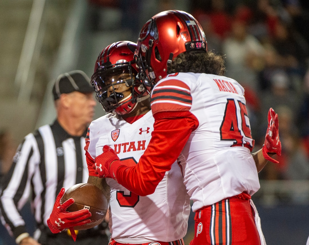 (Rick Egan  |  The Salt Lake Tribune)     Utah Utes wide receiver Samson Nacua (45) contraculates Utah Utes wide receiver Demari Simpkins (3) after he scored a touchdown, in PAC-12 action between the Utah Utes and the Arizona Wildcats in Tucson, Saturday, Nov. 23, 2019.