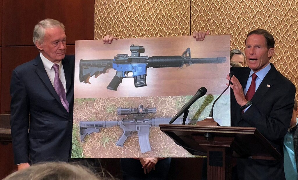 (AP Photo/Matthew Daly) Sen. Edward Markey, D-Mass., left, and Sen. Richard Blumenthal, D-Ct., display a photo of a plastic gun on Tuesday, July 31, 2018, on Capitol Hill in Washington. Democrats are calling on President Donald Trump to reverse an administration decision to allow a Texas company to make blueprints for a 3D-printed gun available online.