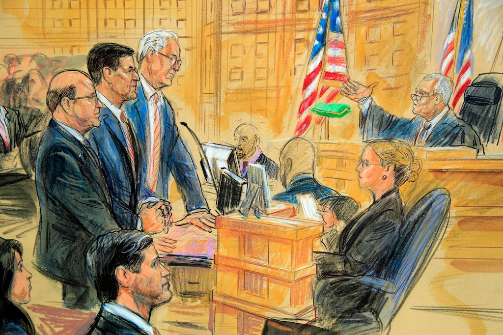 This courtroom sketch depicts former President Donald Trump's former national security adviser Michael Flynn, standing center, flanked by his lawyers, listening to U.S. District Judge Emmet Sullivan, right, as he addresses Flynn and points to the American flag inside the federal court in Washington, Washington, Tuesday, Dec. 18, 2018. Sullivan agreed to postpone Flynn's sentencing so he can continue cooperating with the Russia probe. (Dana Verkouteren via AP)