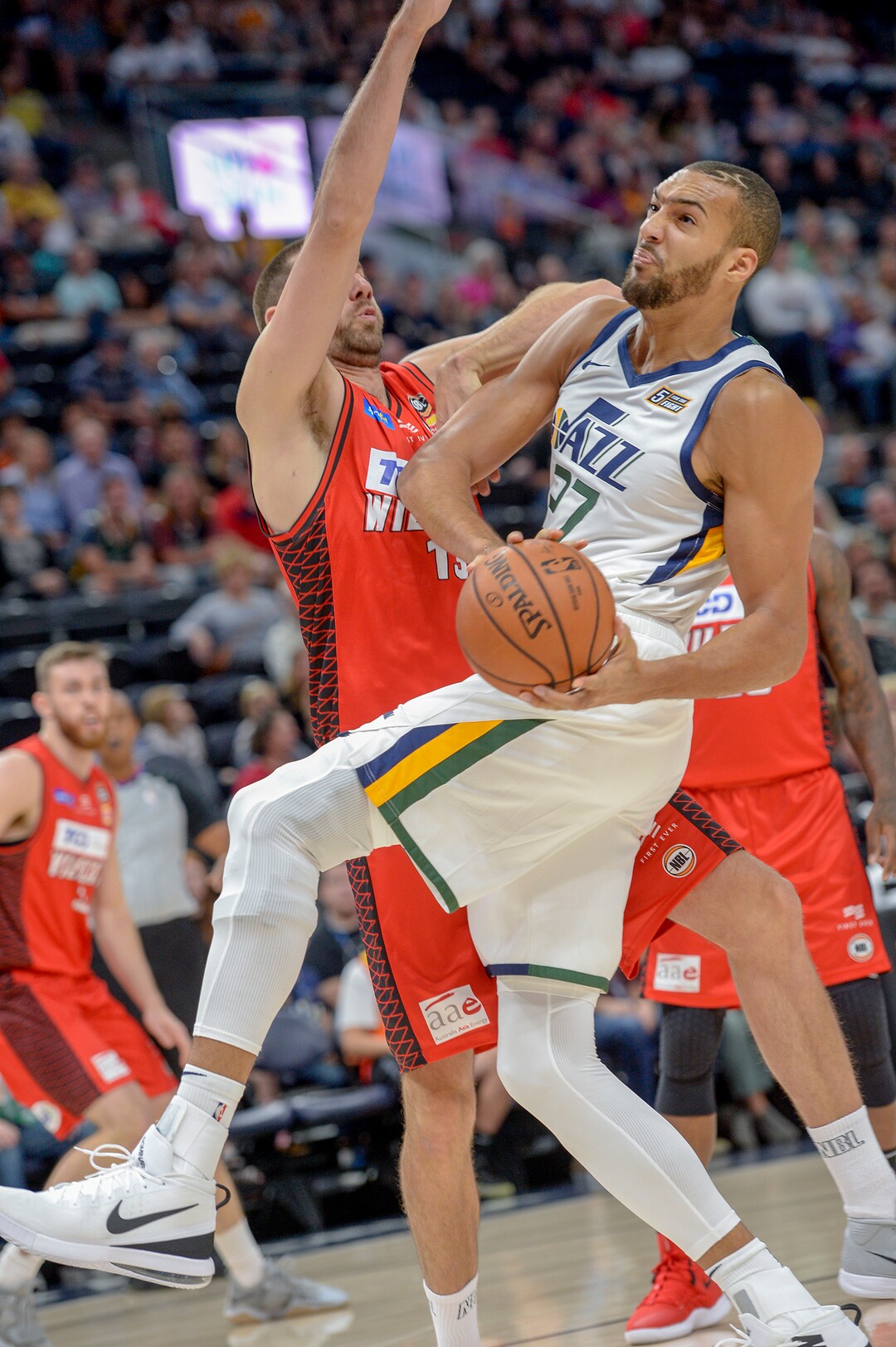 Leah Hogsten  |  The Salt Lake Tribune   Utah Jazz center Rudy Gobert (27) battles Perth Wildcats center Tom Jarvis (13) under the net in the first half as the Utah Jazz host the Perth Wildcats during their preseason game, Sept. 29, 2018 at Vivint Smart Home Arena.