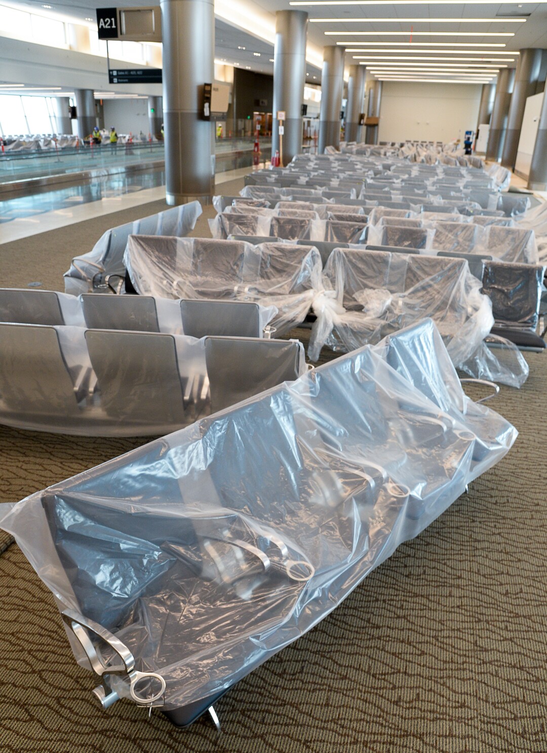 (Francisco Kjolseth  |  The Salt Lake Tribune) Chairs remain covered with plastic as crews continue their work in the first phase of construction of the Salt Lake City International Airport on Wednesday, May 20, 2020.