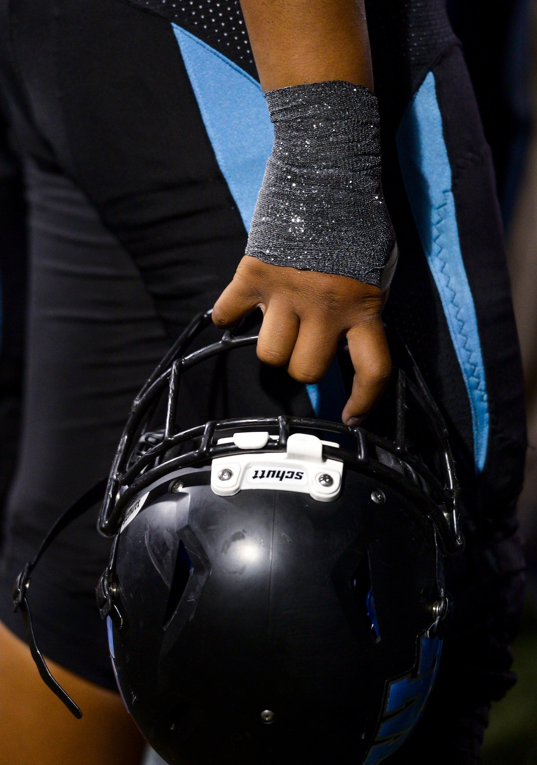 Leah Hogsten  |  The Salt Lake Tribune  West Jordan's defensive end Aleka Leausa sports glittering sports tape. West Jordan High School football team hosts Riverton High School, Thursday, Sept. 13, 2018 in West Jordan. 