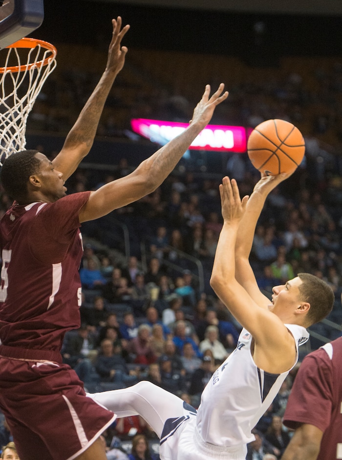 (Rick Egan  |  The Salt Lake Tribune)   Brigham Young Cougars guard Rylan Bergersen (1) takes a shot as Texas Southern Tigers center Trayvon Reed (5) defends, in basketball action, Brigham Young Cougars vs Texas Southern Tigers, at the Marriott Center in Provo, Saturday, December 23, 2017.