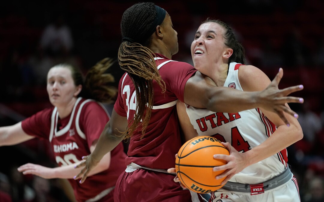 (Francisco Kjolseth | The Salt Lake Tribune) Oklahoma Sooners forward Liz Scott (34) clothes lines Utah Utes guard Kennady McQueen (24) sending her to the floor as the University of Utah hosts the Oklahoma Sooners in women’s NCAA basketball in Salt Lake City on Wednesday, Nov. 16, 2022.