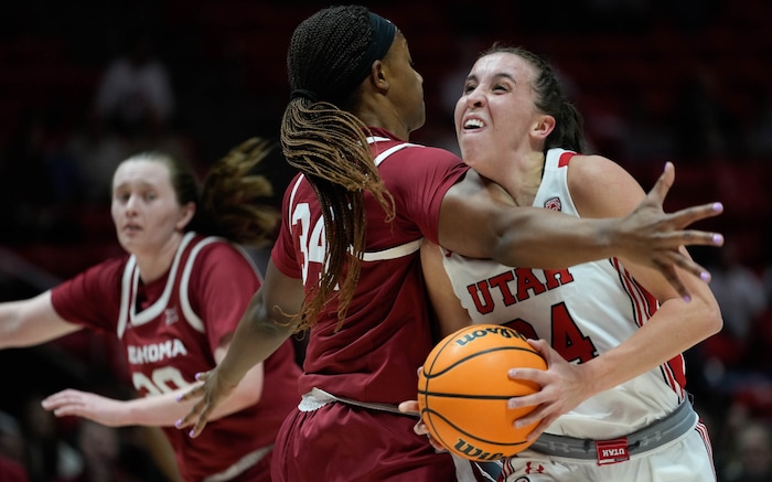 (Francisco Kjolseth | The Salt Lake Tribune) Oklahoma Sooners forward Liz Scott (34) clothes lines Utah Utes guard Kennady McQueen (24) sending her to the floor as the University of Utah hosts the Oklahoma Sooners in women’s NCAA basketball in Salt Lake City on Wednesday, Nov. 16, 2022.