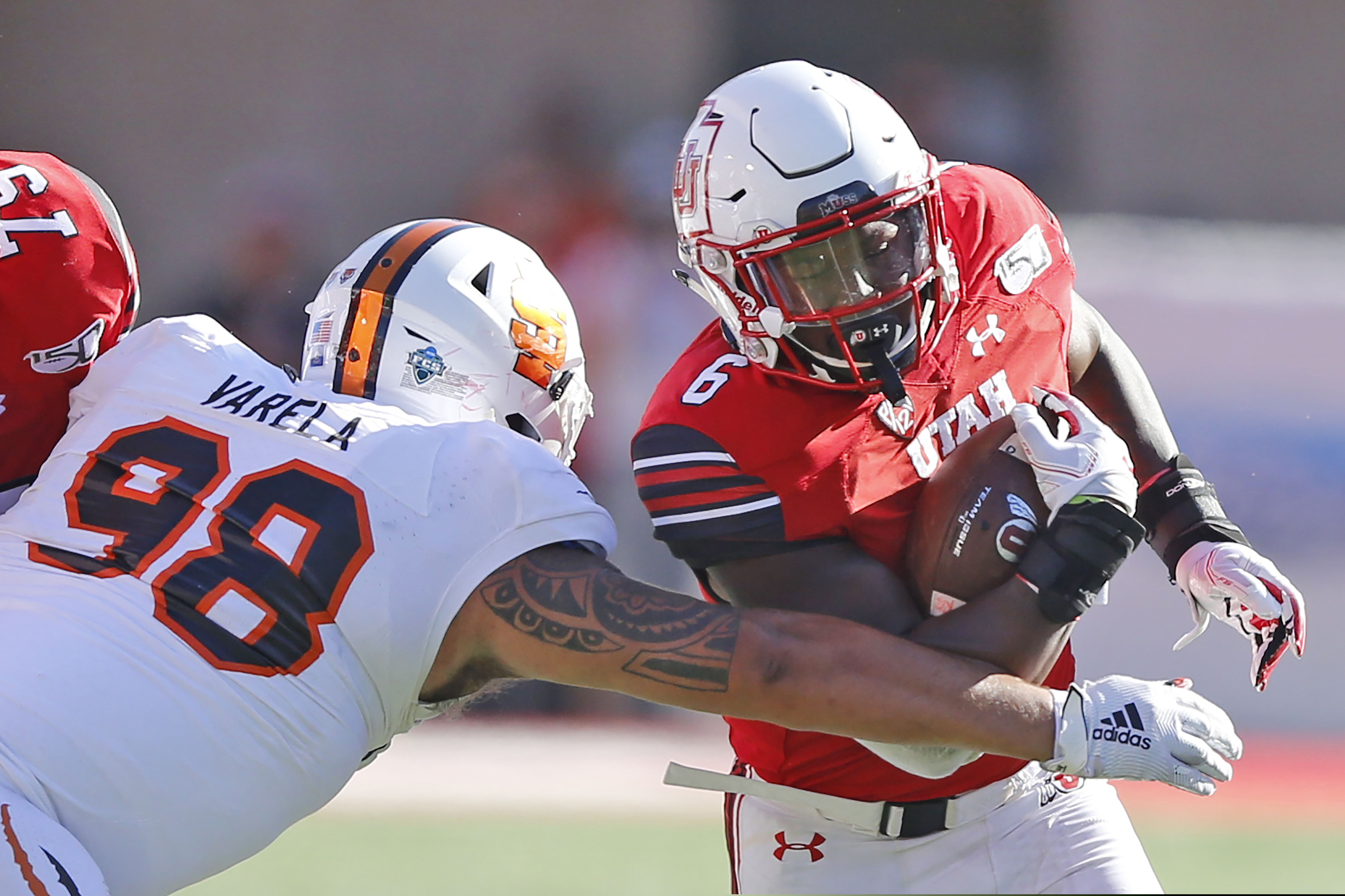 FILE - In this Sept. 14, 2019, file photo, Idaho State defensive lineman Gilbert Varela reaches for Utah running back Devin Brumfield during the second half of an NCAA college football game in Salt Lake City. Devin Brumfield, Jordan Wilmore, Micah Bernard and Ty Jordan will split carries this season. (AP Photo/Rick Bowmer, File)