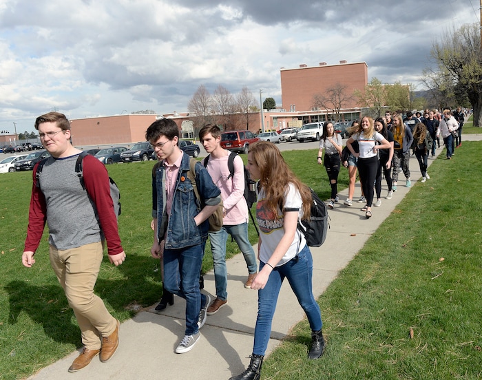 (Al Hartmann  |  The Salt Lake Tribune) 	
Over one hundred students at Highland High School staged a walkout Friday April 20, 2018 in honor of the anniversary of the Columbine High School massacre. Demonstrators walked from the school to Sugar House Park where they made posters, wrote letters to their congressmen and listened to speakers. 