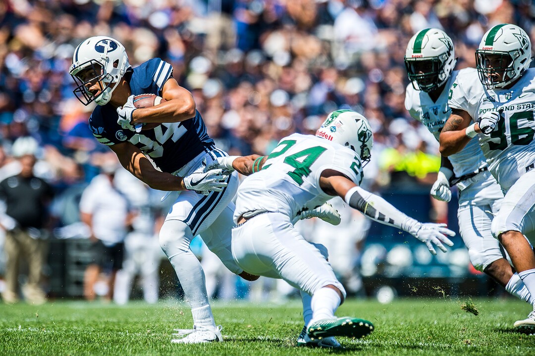 (Chris Detrick  |  The Salt Lake Tribune)  Brigham Young Cougars wide receiver Neil Pau'u (84) runs for a touchdown past Portland State Vikings cornerback Artuz Manning (24) during the game at LaVell Edwards Stadium Saturday, August 26, 2017.