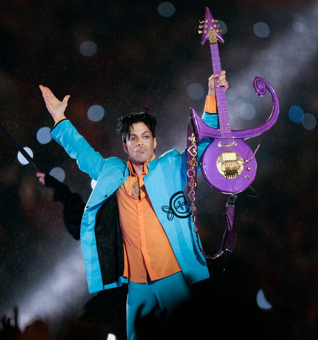 FILE - In this Feb. 4, 2007 file photo, Prince performs during halftime of the Super Bowl XLI football game in Miami. Minnesota prosecutors are planning an announcement Thursday, April 19, 2018, in their two-year investigation into Prince's death. Prince was found alone and unresponsive in an elevator at his Paisley Park estate on April 21, 2016. An autopsy found he died of an accidental overdose of fentanyl, a synthetic opioid 50 times more powerful than heroin. (AP Photo/Chris O'Meara, File)