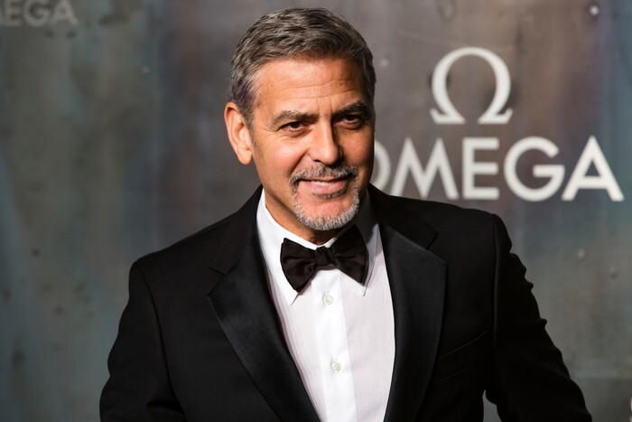 FILE - In this April 26, 2017 file photo, actor-director George Clooney arrives at the 60th anniversary of the Omega Speedster watch in London. Clooney directs the upcoming film, "Suburbicon," written by starring Matt Damon, Oscar Isaac and Julianne Moore. (Photo by Grant Pollard/Invision/AP, File)