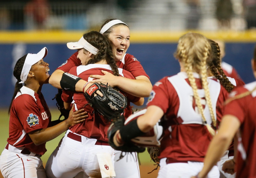 (Sue Ogrocki | AP) Paige Parker, center, celebrates with teammates after Oklahoma defeated LSU in a semi final game in the NCAA Women's College World Series in Oklahoma City, Monday, June 6, 2016. Parker is now a pitching coach at the University of Utah.