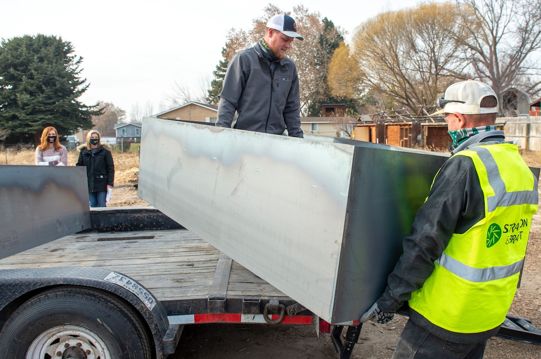 (Rick Egan | The Salt Lake Tribune)  Workers from Stratton and Brätt unload planter boxes that will be placed on the small farm owned by Jennie Taylor's family, Thursday, Dec. 10, 2020.