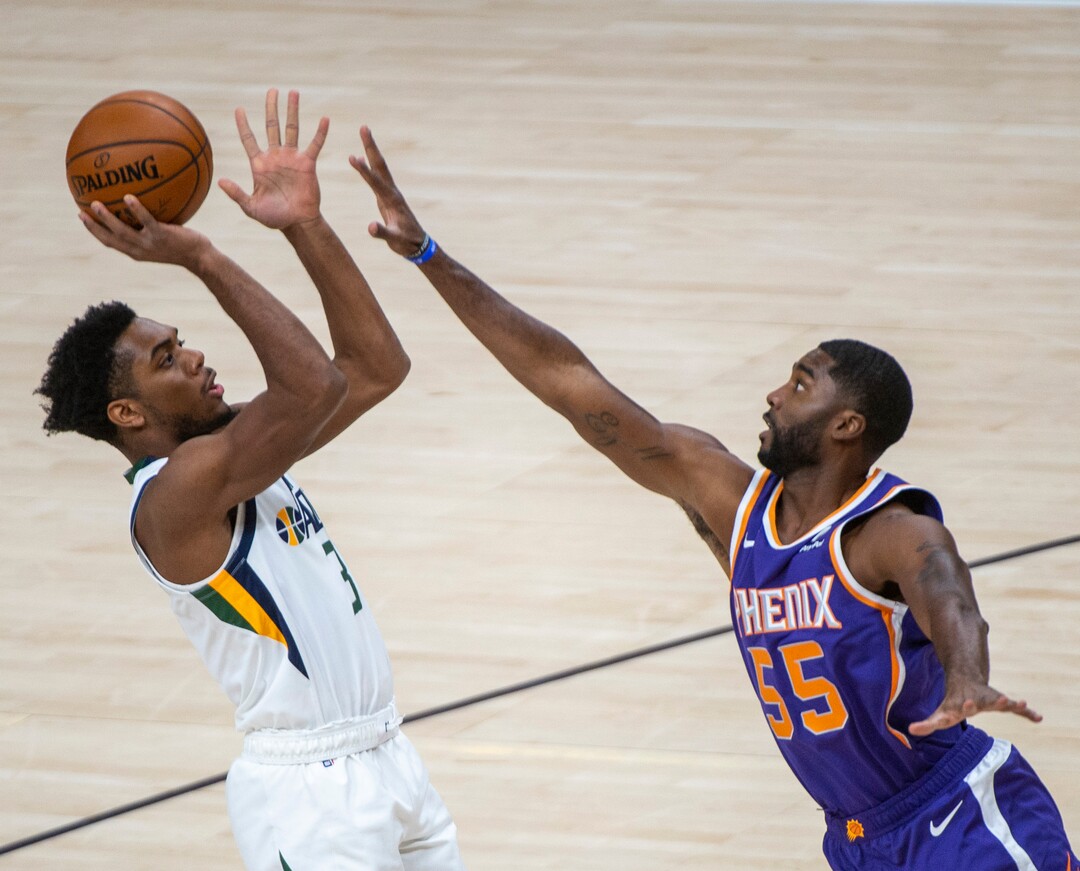 (Rick Egan | The Salt Lake Tribune)  Utah Jazz guard Justin Wright-Foreman (3) shoots over Phoenix Suns guard E'Twaun Moore (55) defends, in preseason NBA action between Utah Jazz and Phoenix Suns at Vivint SmartHome Area, on Saturday, Dec. 12, 2020.