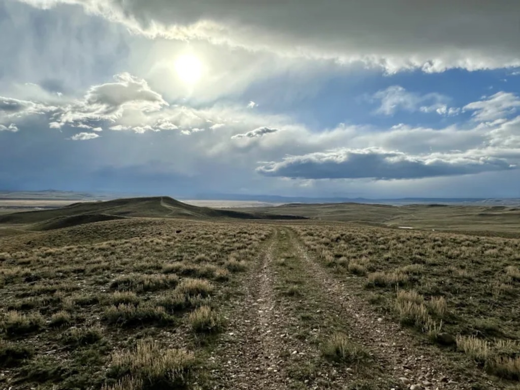 ( (Mike Koshmrl | WyoFile) A two-track road cuts through Bureau of Land Management property west of Pinedale in April 2024.
