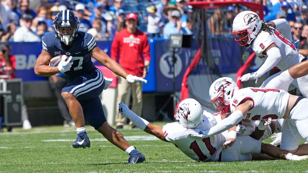 (Rick Bowmer | AP) BYU running back LJ Martin (27) breaks free from Southern Utah safety George Ramirez (11) during the first half of an NCAA college football game Saturday, Sept. 9, 2023, in Provo.