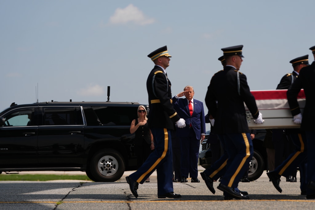 (Julia Demaree Nikhinson | AP) President Donald Trump salutes as a U.S. Army carry team moves a transfer case containing the remains of 1st Lt. Tyler James Feehan of Ewa Beach, Hawaii, Wednesday, July 22, 2026, at Dover Air Force Base, Del.